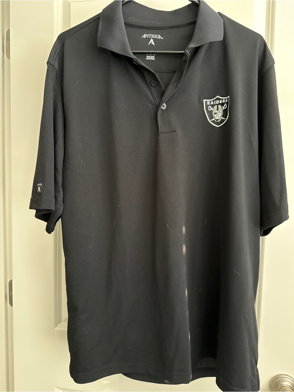 Antigua Men’s Raiders Black Polo with Chest Crest